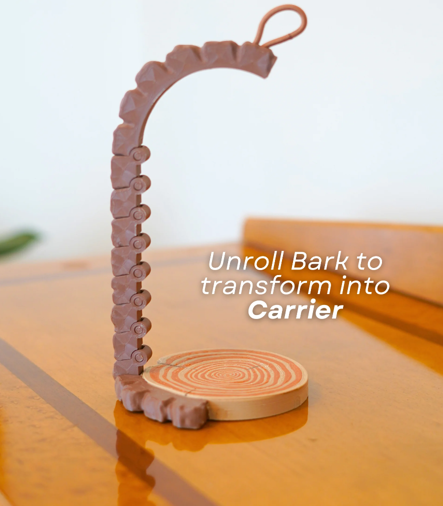 Wooden product with text 'Unroll Bark to transform into Carrier' on a wooden surface.